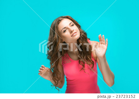 The young woman's portrait with happy emotions The young woman's portrait with happy emotions 23723152