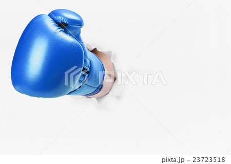 hand in boxing glove broke through the paper wall hand in boxing glove broke through the paper wall 23723518