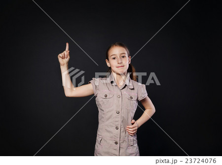 Small girl has idea. Child shows finger up, eureka Small girl has idea. Child shows finger up, eureka 23724076