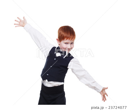 Redhead boy in a vest with bow tie, portrait 23724077