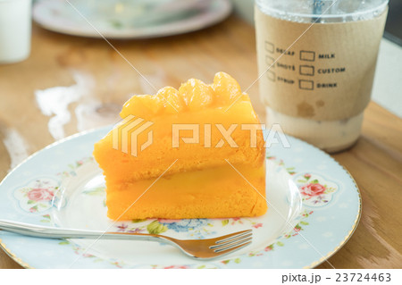 Orange cake and cold coffee 23724463