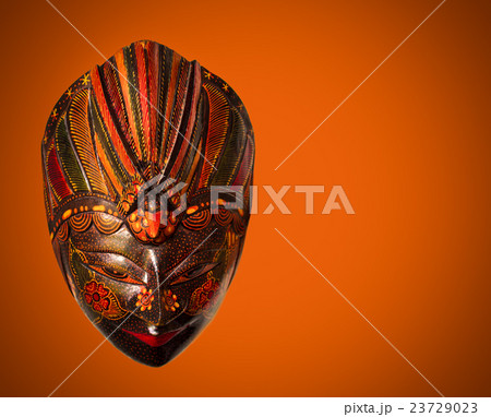 Traditional Indonesian mask in Bali stile on red Traditional Indonesian mask in Bali stile on red 23729023