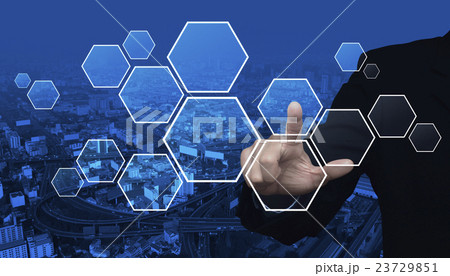 Businessman hand pushing blank hexagon shape Businessman hand pushing blank hexagon shape 23729851