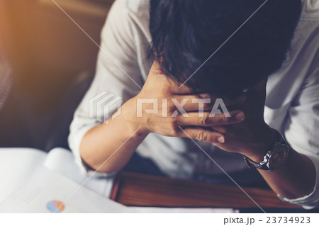 Worried businessman sitting in his office. Worried businessman sitting in his office. 23734923