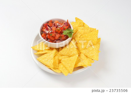 tortilla chips and tomato salsa tortilla chips and tomato salsa 23735506