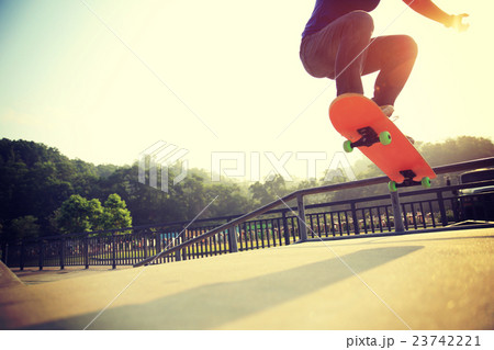 young skateboarder skateboarding at skatepark 23742221