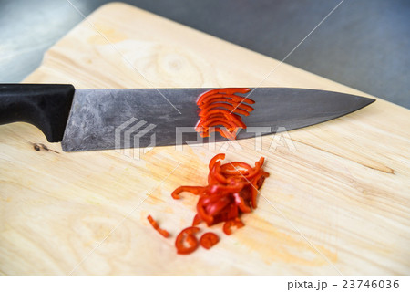 Cutting chili pepper Cutting chili pepper 23746036