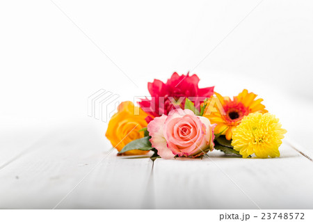 Fragrant flowers on wooden background 23748572