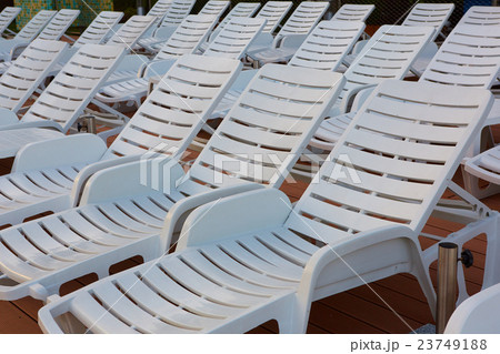 number of empty sunbeds at the pool early in the 23749188