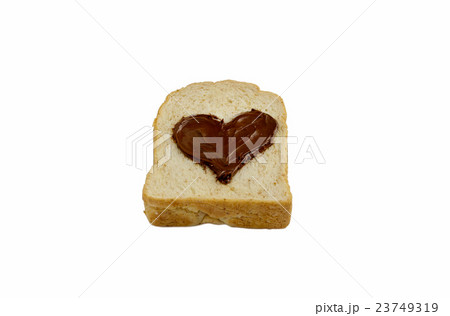 slice bread with heart shape of chocolate spread. 23749319