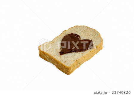 slice bread with heart shape of chocolate spread. 23749320