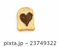Slice bread with heart shape of hazelnut spread. 23749322