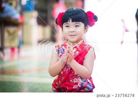 The Little Asian girl wishing you a happy Chinese new year The Little Asian girl wishing you a happy Chinese new year 23756278