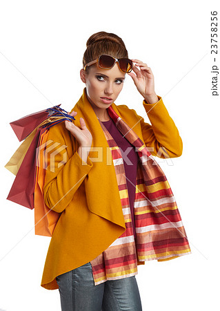 Woman wearing autumn overcoat and scarf  23758256