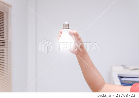 Woman hand holding LED bulb 23763722