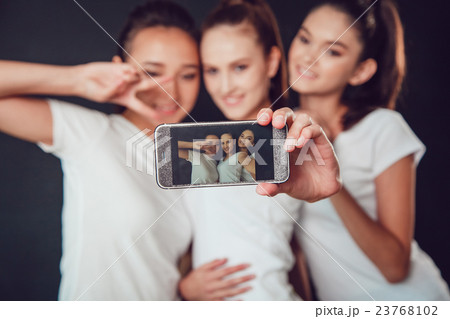 Positive friends portrait of happy girls making 23768102