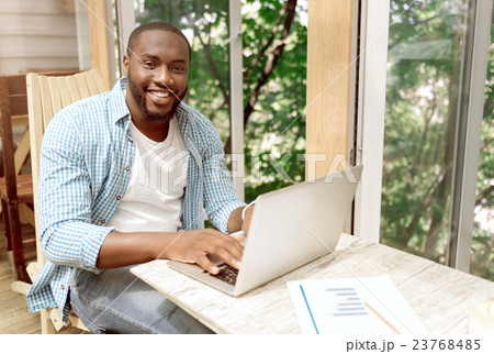 Delighted smiling woman using laptop 23768485
