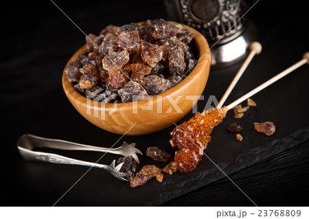 Brown sugar in a bowl 23768809