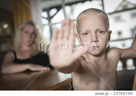 sad face kid and hand raise to stop or protect 23769700