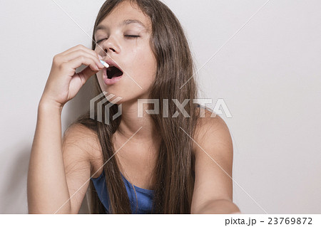 Depressed teenager with pills 23769872