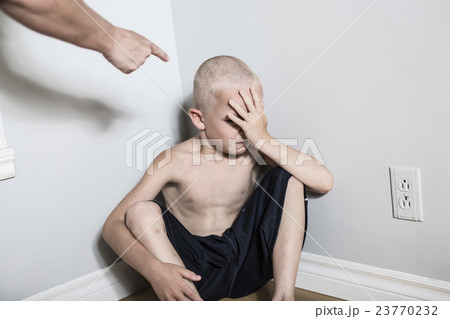 Neglected lonely child leaning at the wall 23770232