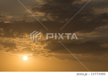 sunset sky background, light rays of sunbeam 23773400