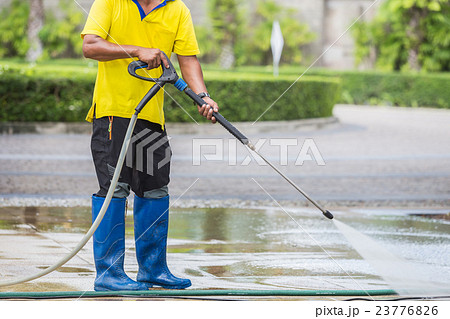 Close up Outdoor floor cleaning with high pressure water jet Close up Outdoor floor cleaning with high pressure water jet 23776826