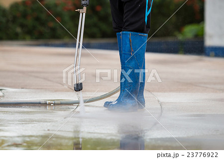 Close up Outdoor floor cleaning with high pressure water jet Close up Outdoor floor cleaning with high pressure water jet 23776922