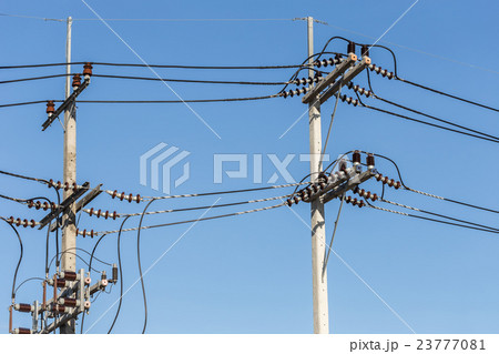 Electric pole connect high voltage electric wires on blue sky 23777081