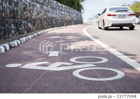 White bicycle sign or icon on the road 23777098