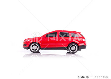 Red model car with reflection isolated on white Red model car with reflection isolated on white 23777300