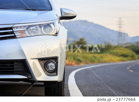 Front of new silver car parking on the asphalt road 23777668