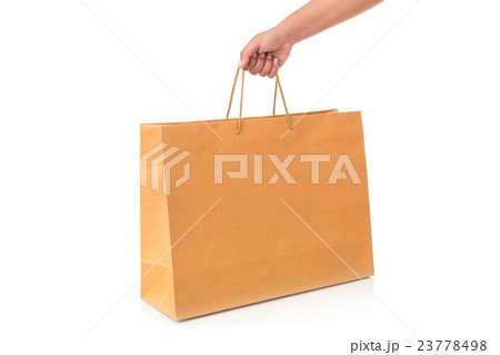 Close up hand holding brown paper bag isolated on white 23778498