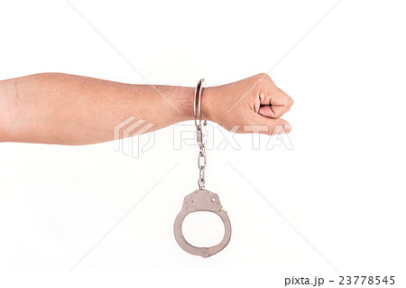 Close up hands with silver handcuffs isolated on white Close up hands with silver handcuffs isolated on white 23778545