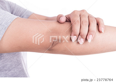 Close up woman's hand holding her elbow isolated on white. Elbow pain concept. Close up woman's hand holding her elbow isolated on white. Elbow pain concept. 23778764
