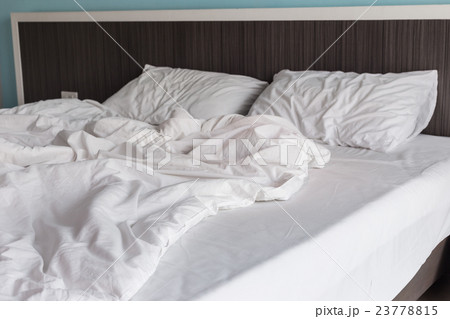 White bedding sheets and pillow, Messy bed concept White bedding sheets and pillow, Messy bed concept 23778815