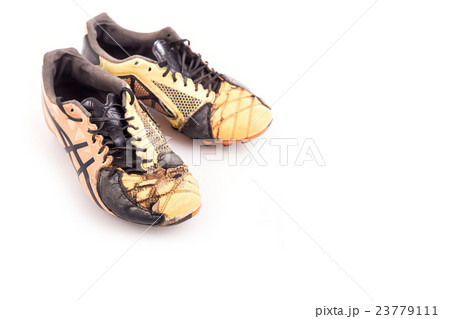 Old football shoes isolated on white Old football shoes isolated on white 23779111