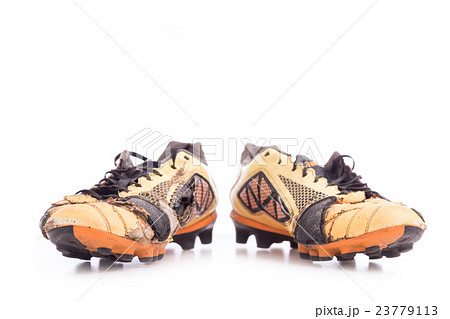 Old football shoes isolated on white Old football shoes isolated on white 23779113
