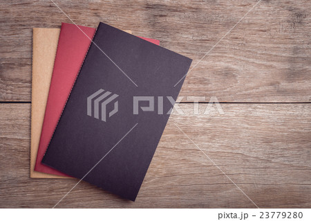 Notepad / lined paper on wooden table top view 23779280