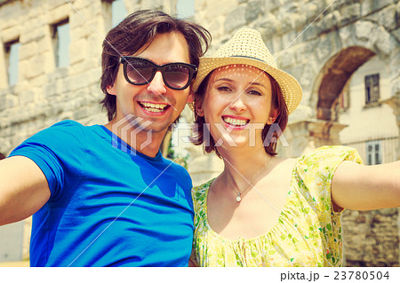 Tourist Couple Taking Selfie in Ancient Arena 23780504