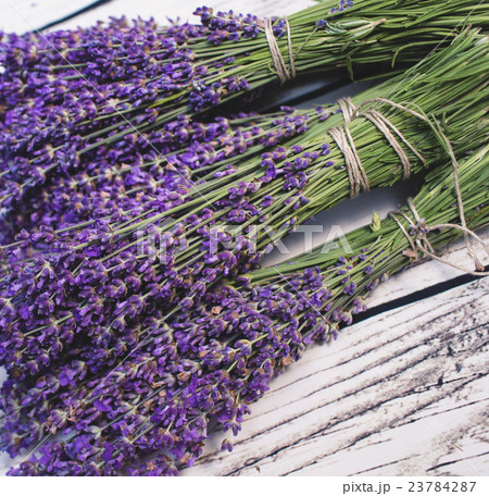 Lavender bunch on wood background 23784287