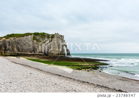 The beach and stone cliffs in Etretat, France 23786547