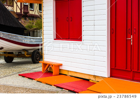 Fishing boat near bright wooden house 23786549