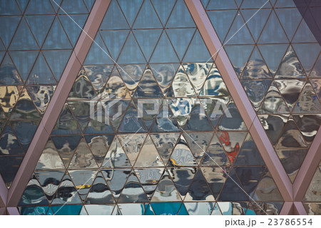 City reflections in skyscraper mirror glass facade 23786554