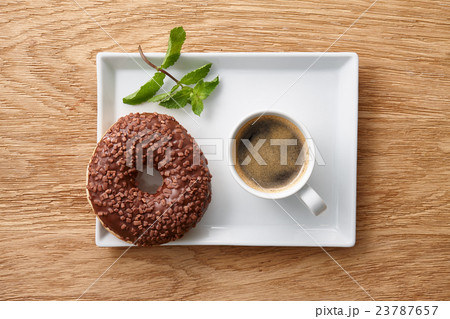Espresso coffee with chocolate pieces on plate Espresso coffee with chocolate pieces on plate 23787657