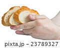Man holding white bread slices in his hands 23789327