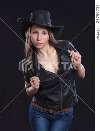 Young sexy girl in fur waistcoat and cowboy hat Young sexy girl in fur waistcoat and cowboy hat 23796754