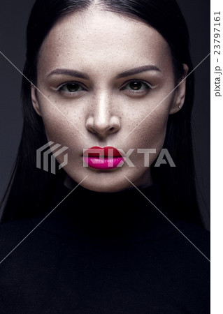 Beautiful brunette girl in a black dress, straight Beautiful brunette girl in a black dress, straight 23797161