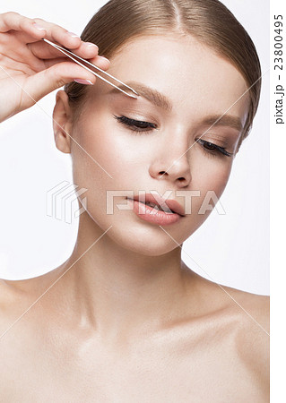 Beautiful young girl with a light natural make-up Beautiful young girl with a light natural make-up 23800495