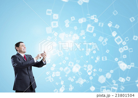 Businessman using smartphone . Mixed media 23801504